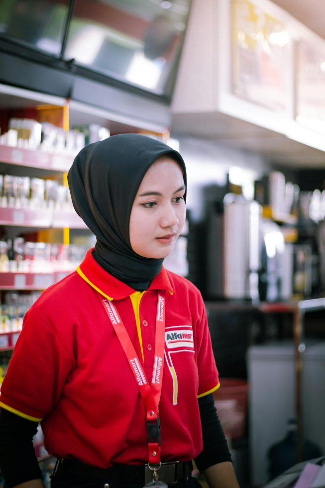 working in shop a girl working in a convenience store