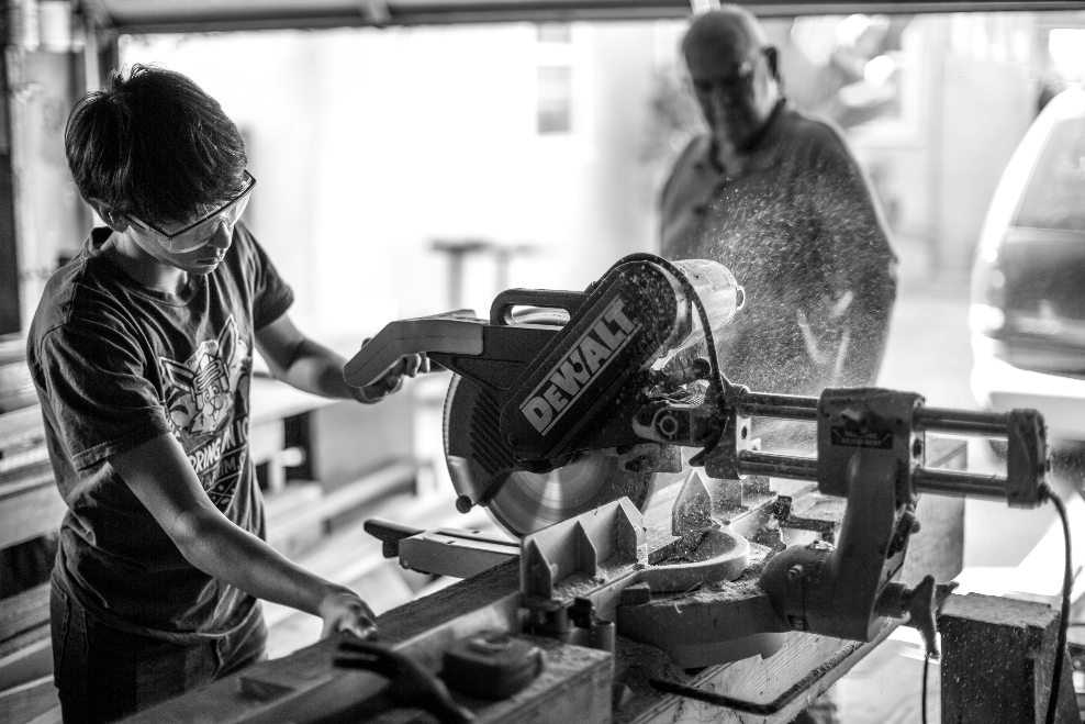an apprentice working on a machine