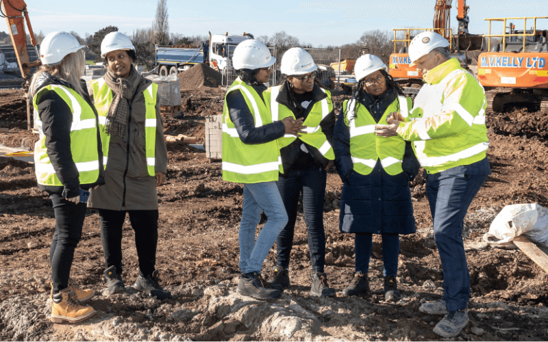 women-in-construction-site group of women in high visibility jackets in a construction site