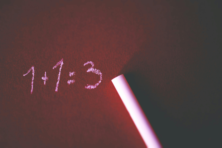 misconceptions a 1+1=3 written on a board with pink chalk