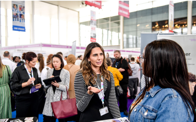 A young woman speaks to a careers advisor