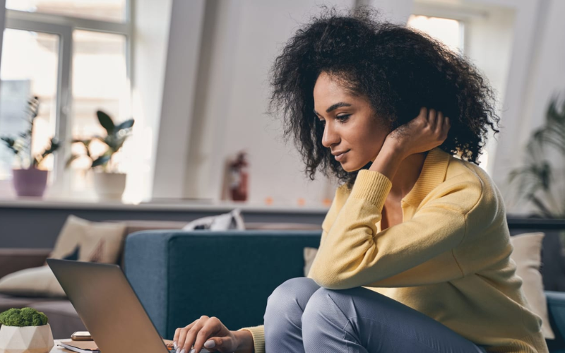 woman looking at a laptop